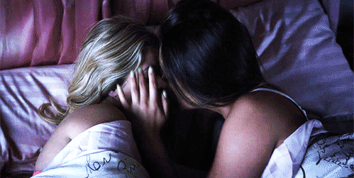 lesbians kissing in bed