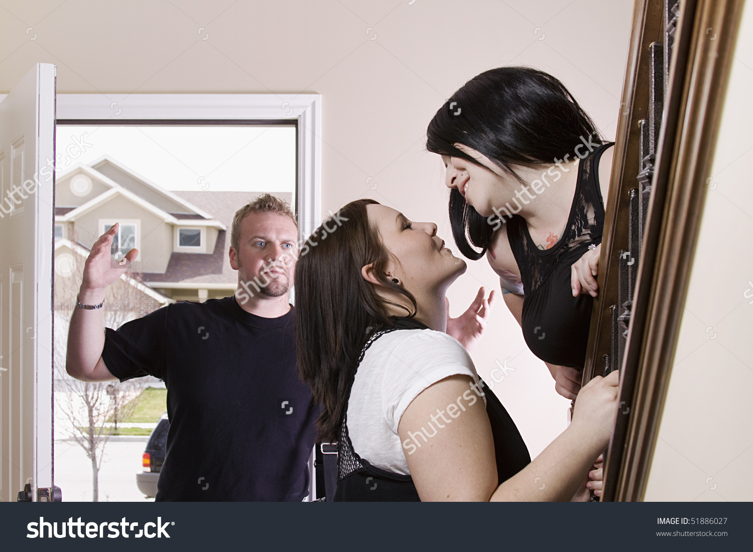 stock-photo-husband-coming-home-finding-his-wife-cheating-with-another-woman-51886027
