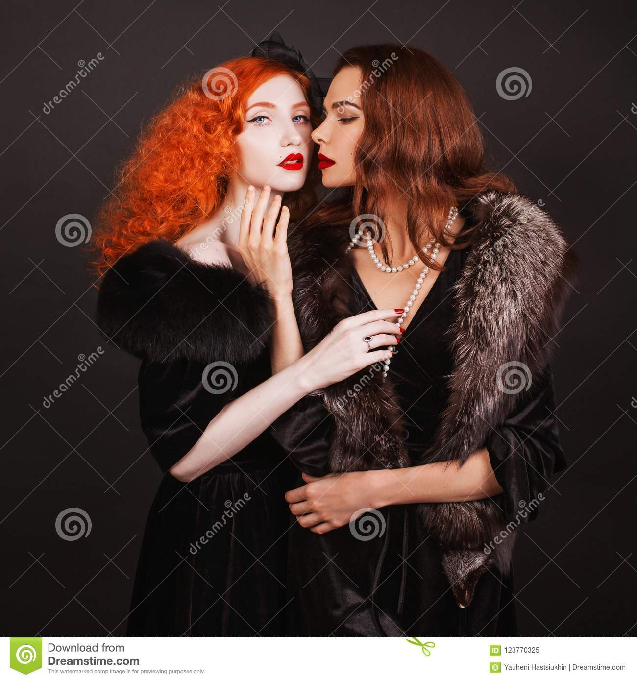 two-young-lesbian-women-curly-long-hair-black-dress-touch-each-other-brutal truth